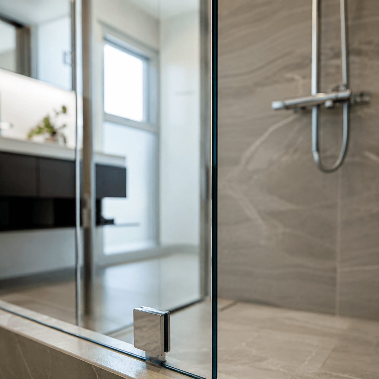 Brand-new shower glass at month one — crystal clear